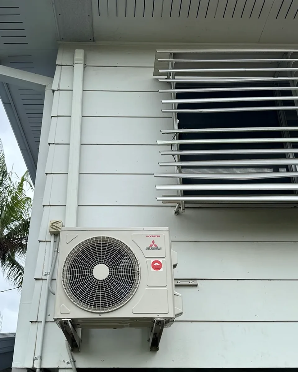 Mitsubishi Heavy Industries split-system outdoor unit installed on wall brackets