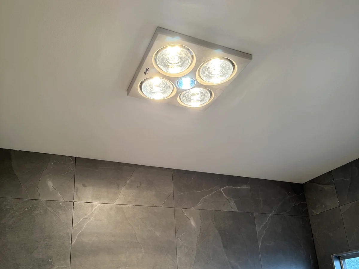Bathroom heat lamp and lighting installation